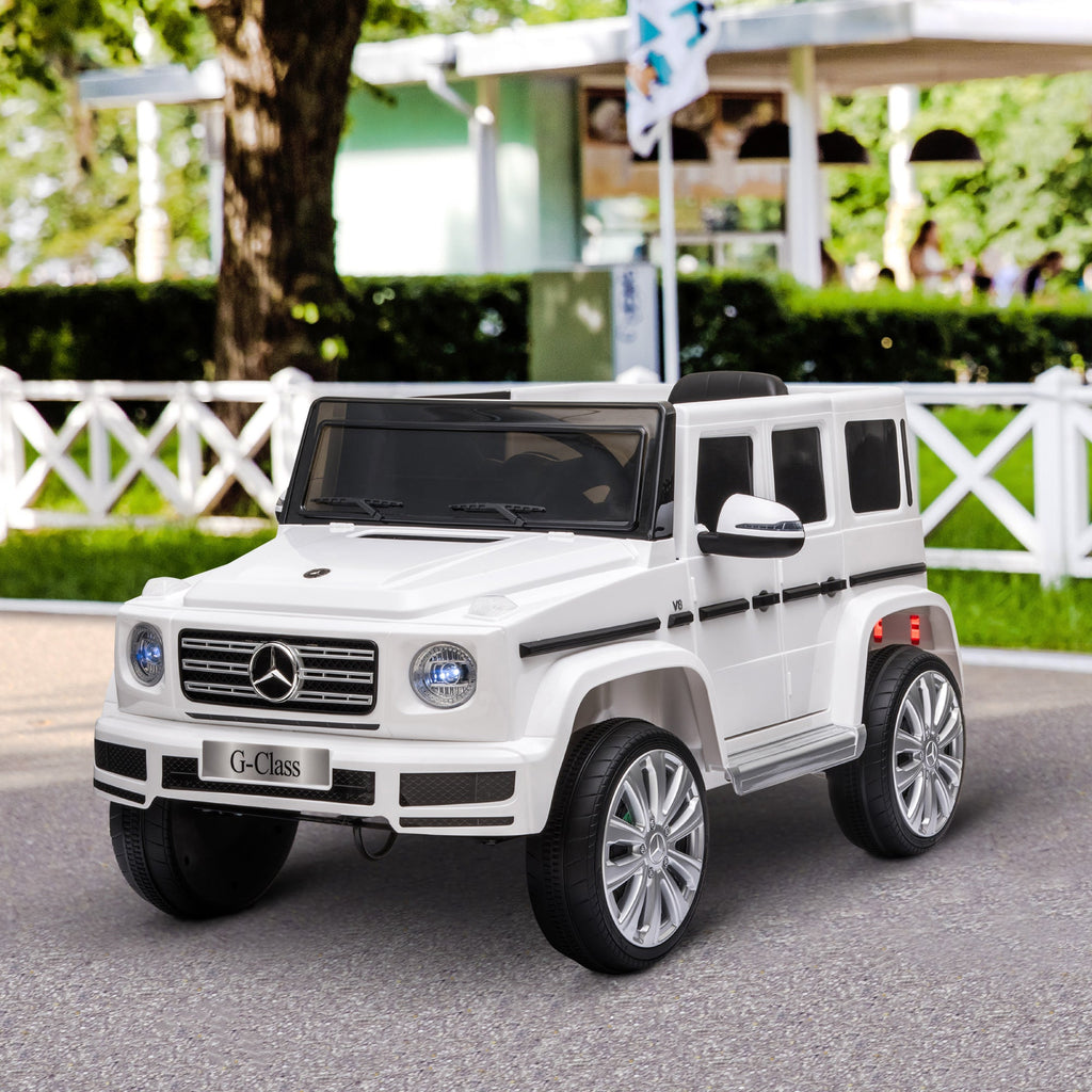 Mercedes Benz G500 Brinquedo elétrico para crianças com licença oficial, 12 V, com controlo remoto parental, alimentado a bateria, 2 motores, luzes musicais, MP3, para crianças dos 3 aos 8 anos, branco